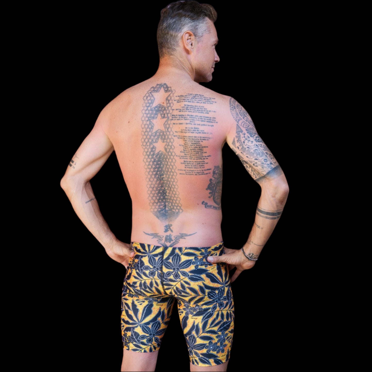 Fit Man wearing Thaiger pattern Jammers standing with hands on hips