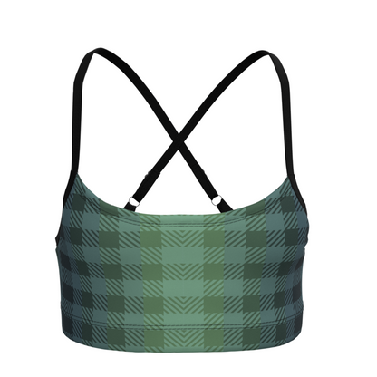 Green checked plaid sports bra with black straps on a white background