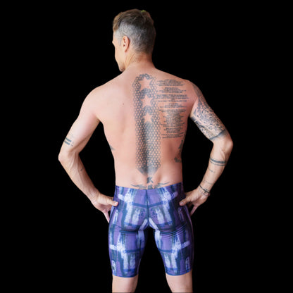 Fit Man wearing Purple pattern Jammers standing with hands on hips