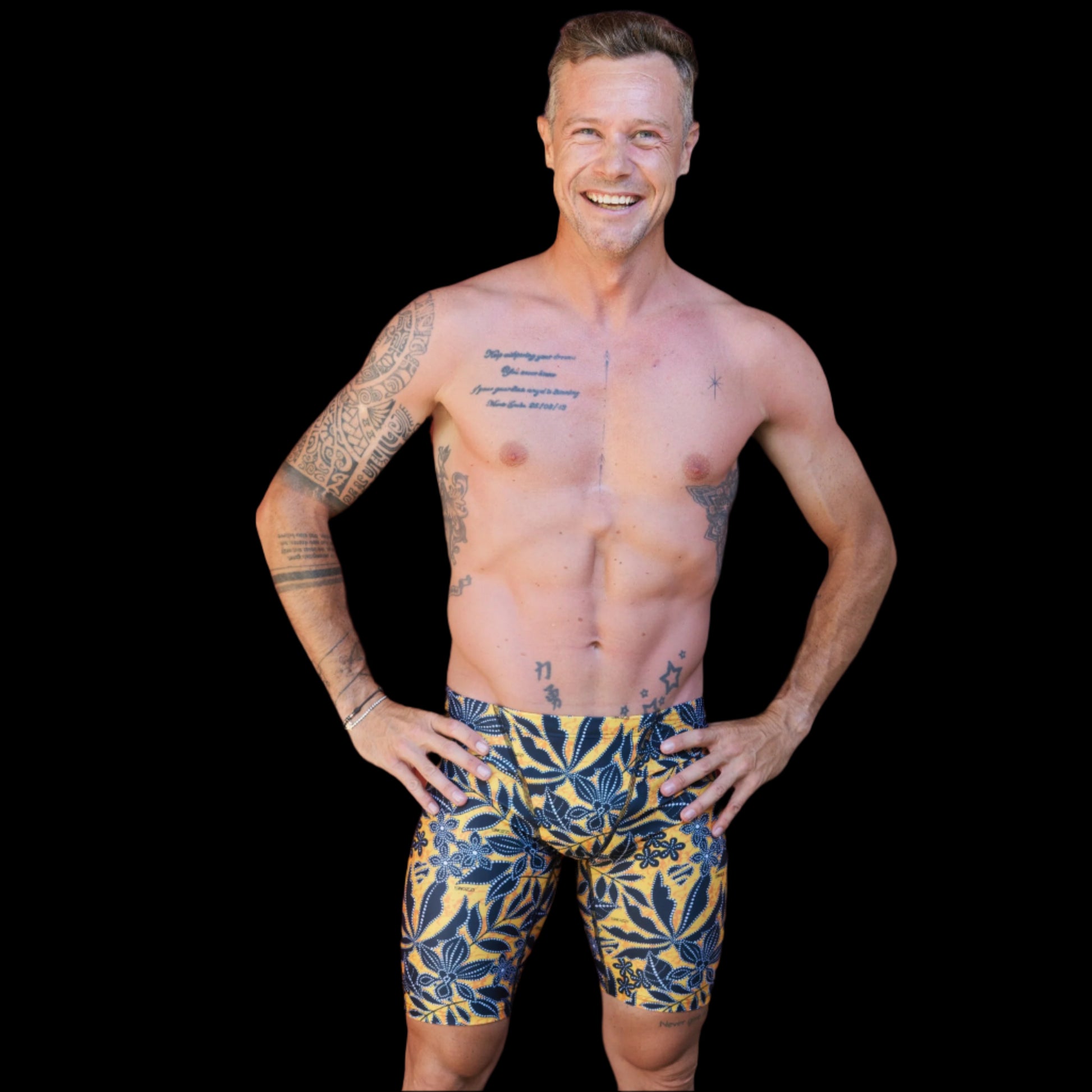 Fit Man wearing black Tribal pattern Jammers standing with hands on hips